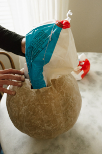 removing beach ball from paper mache pumpkin